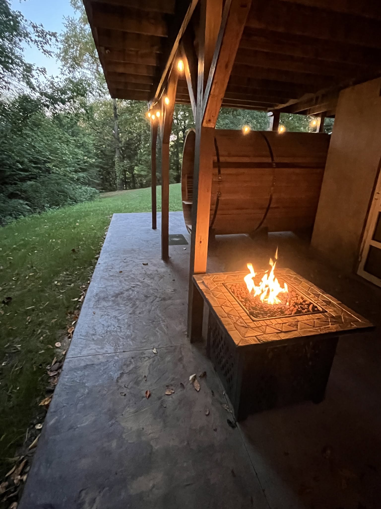 A warm fire on the covered cabin patio
