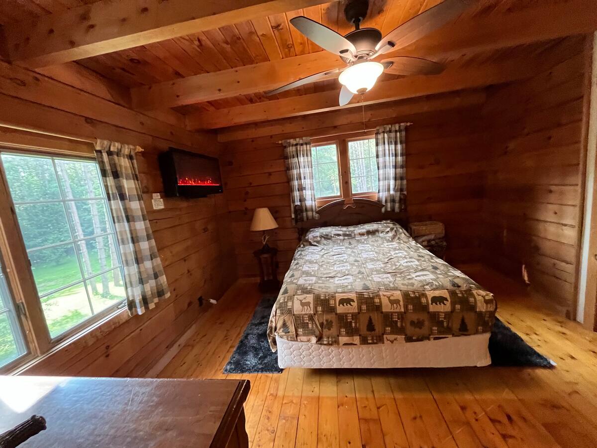 Wood-paneled cabin bedroom
