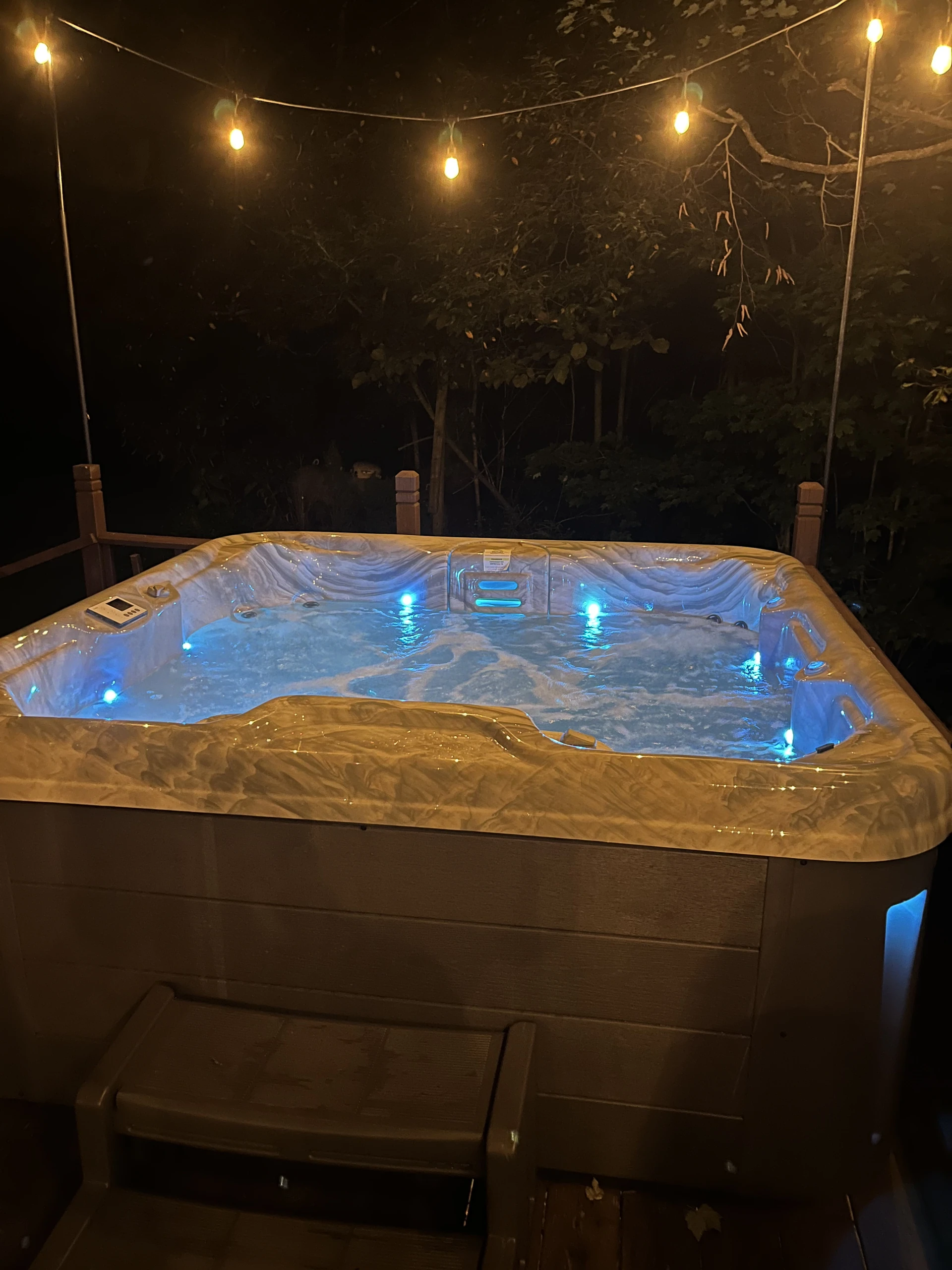 Hot tub beneath the string lights